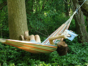 Reading a romance in a hammock